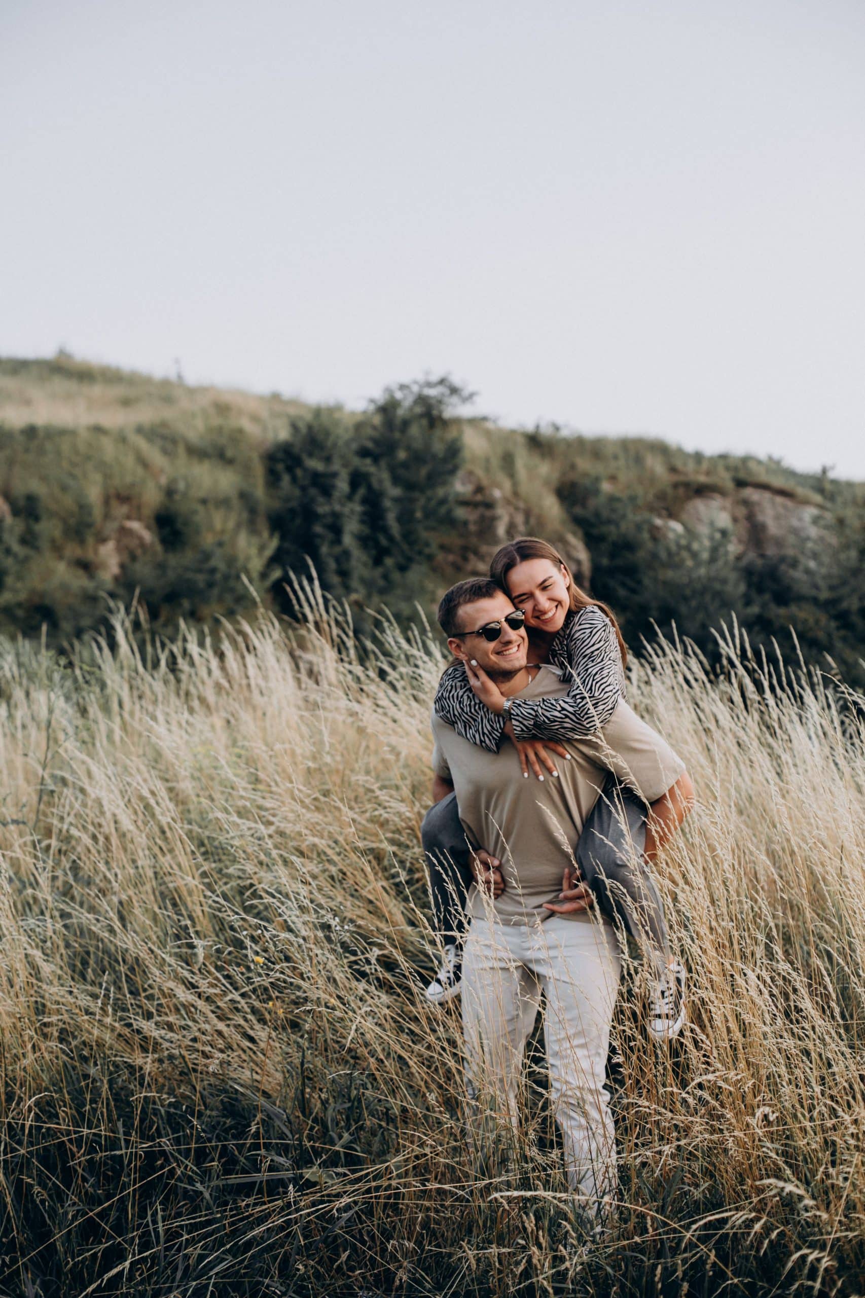 Young Couple Together in Meadow | Wellspring Counselling Inc.