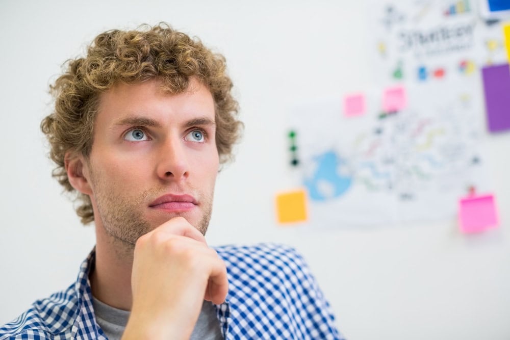 Thoughtful young man contemplating mental health and counselling services at Wellspring Counselling in Ontario, Canada.
